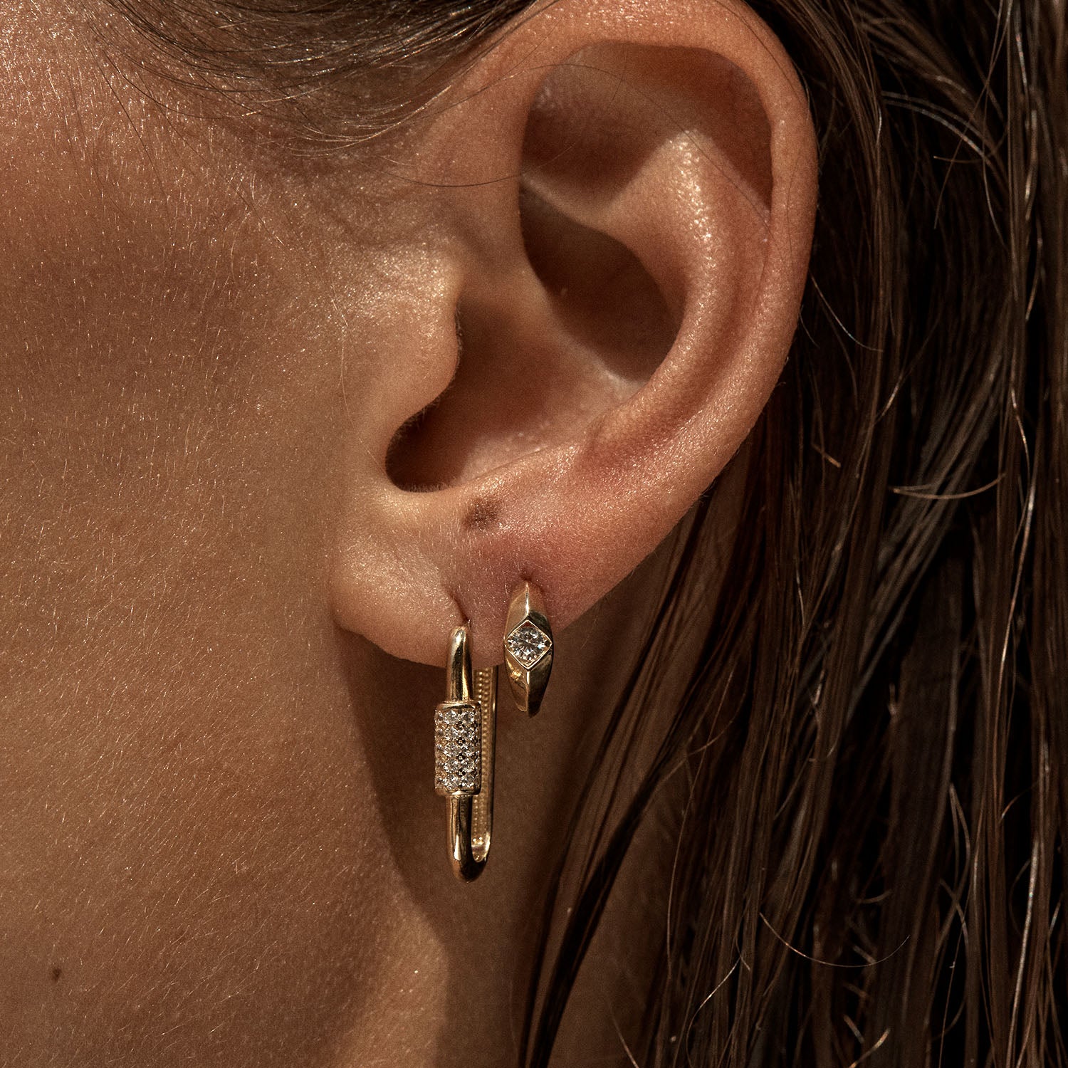 9ct gold diamond helix huggie earrings on ear – fine jewellery close-up