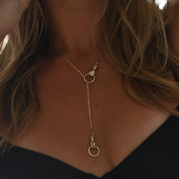 Golden Embrace: Hands of Infinity Necklace
