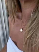 Solid gold necklace with cupid and cross charms solid gold